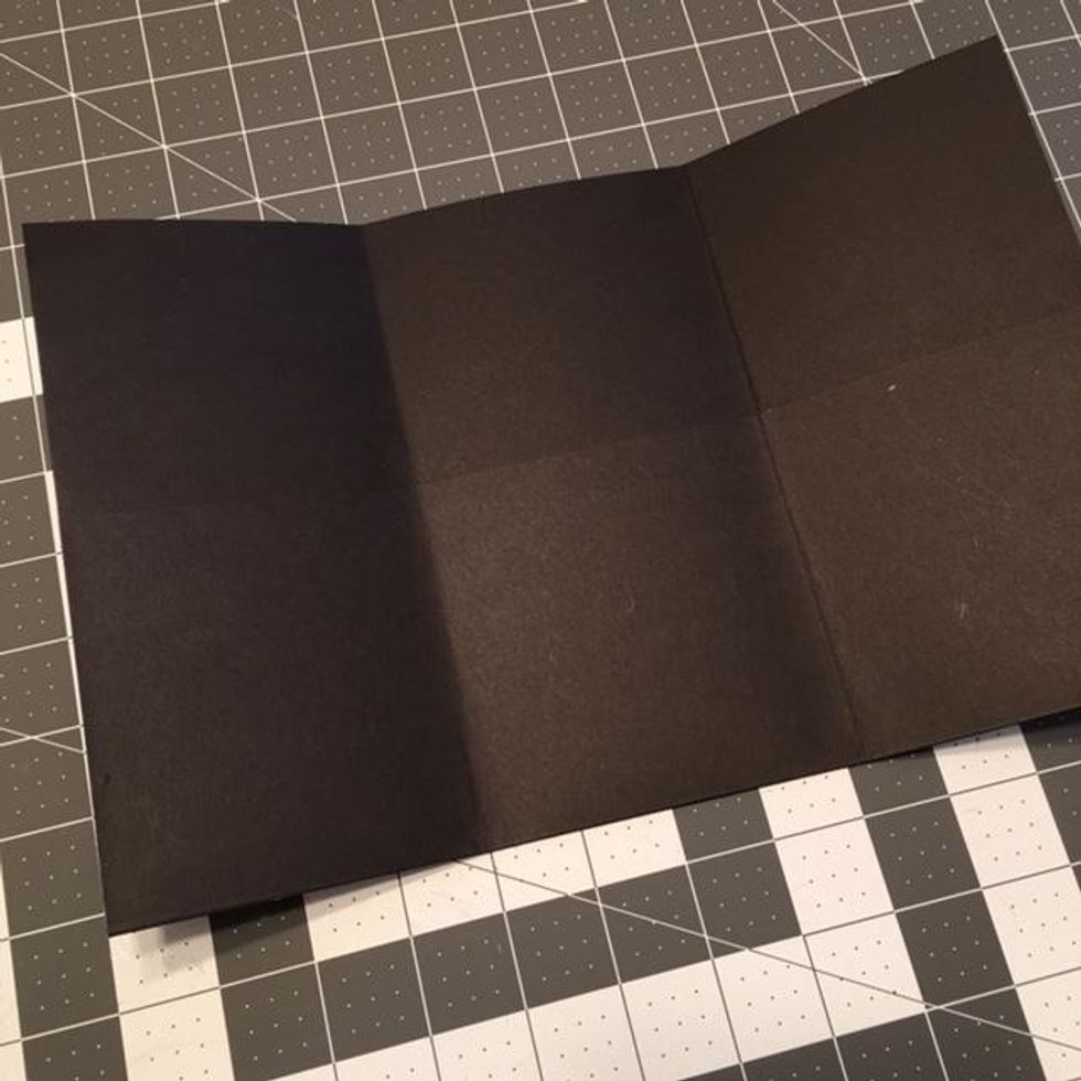 Your booklet should look like this after you have folded the bottom up for the pockets and folded the sides.  The pockets will be on the inside of the booklet.