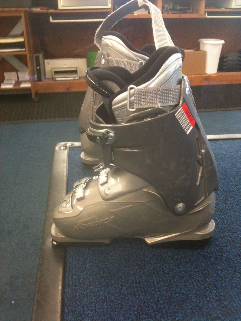 Your boot will be difficult to slide into and your toes may be close to the front but when you are skiing your foot will be in the back of the boot