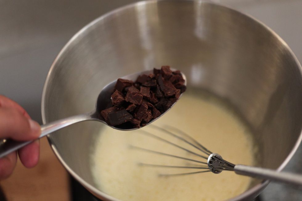 Your cream should start to gently bubble around the sides of the tempering bowl. This is about the maximum amount of chocolate you should dissolve each time. It dissolved fast, it won't take too long