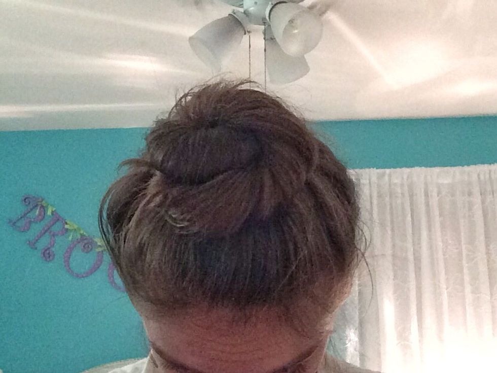 Your hair should now look like a cinnamon bun. Now, keep bobby pinning your hair until you think it is tight enough.