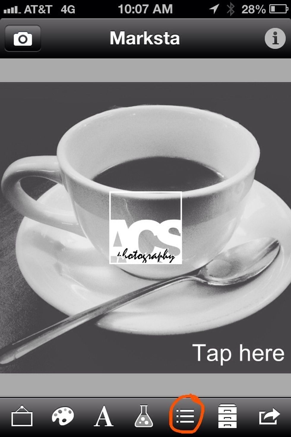 Your image will load center screen, but you will still see the default "Tap Here" text as well. To get rid of that, tap the "row handles" icon in the menu - circled in the screen shot for you.