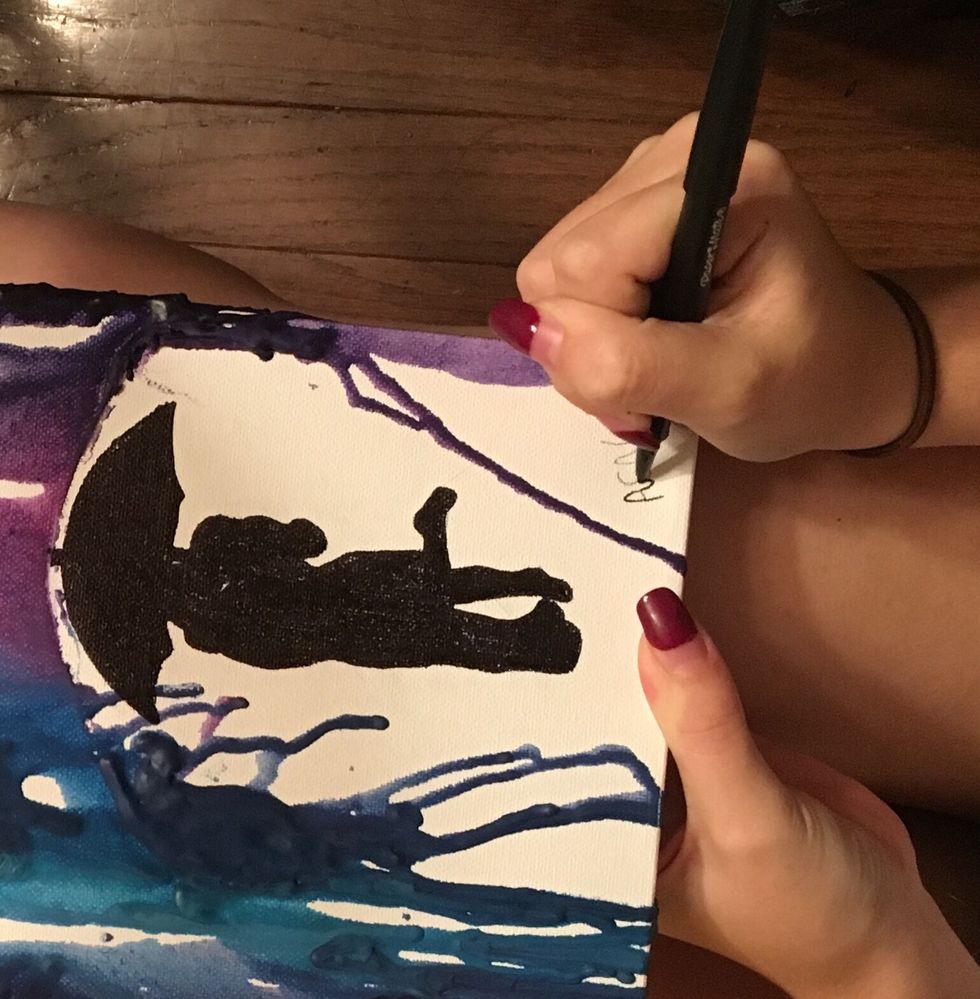 Your last and final step is to sign your masterpiece and let the art dry over night. It dries very quickly but we want to make sure the blobs are fully dried as well.