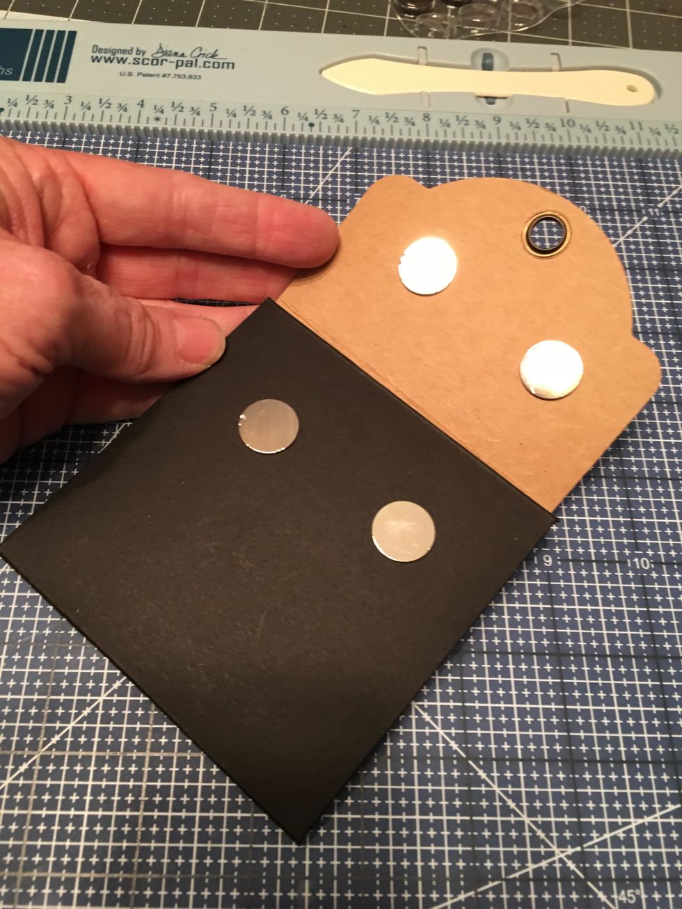 Your magnets should now look like this with the plus ones on the flap and the minus ones on the front section of the album.