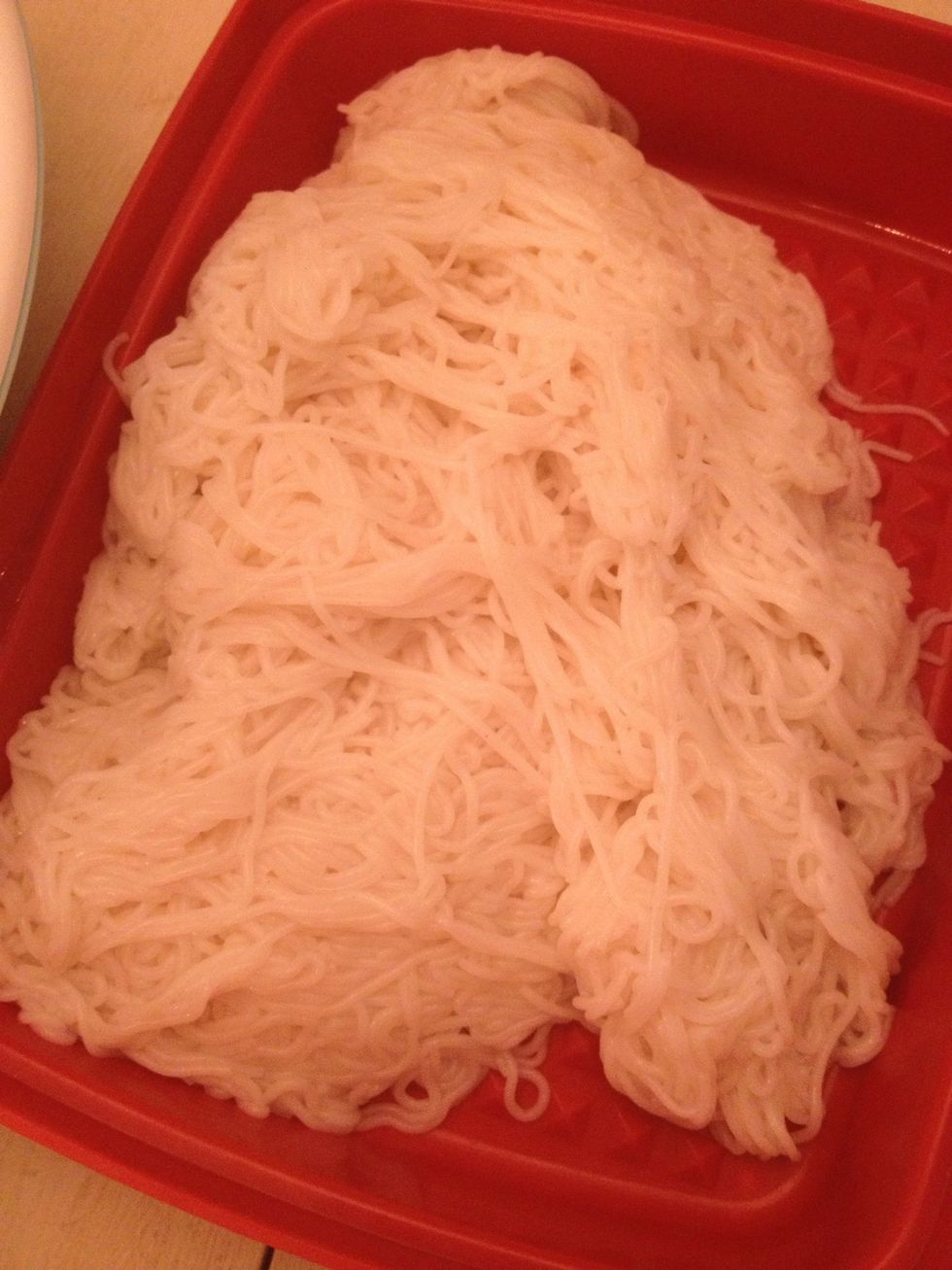Your noodle is drained and ready in a container.