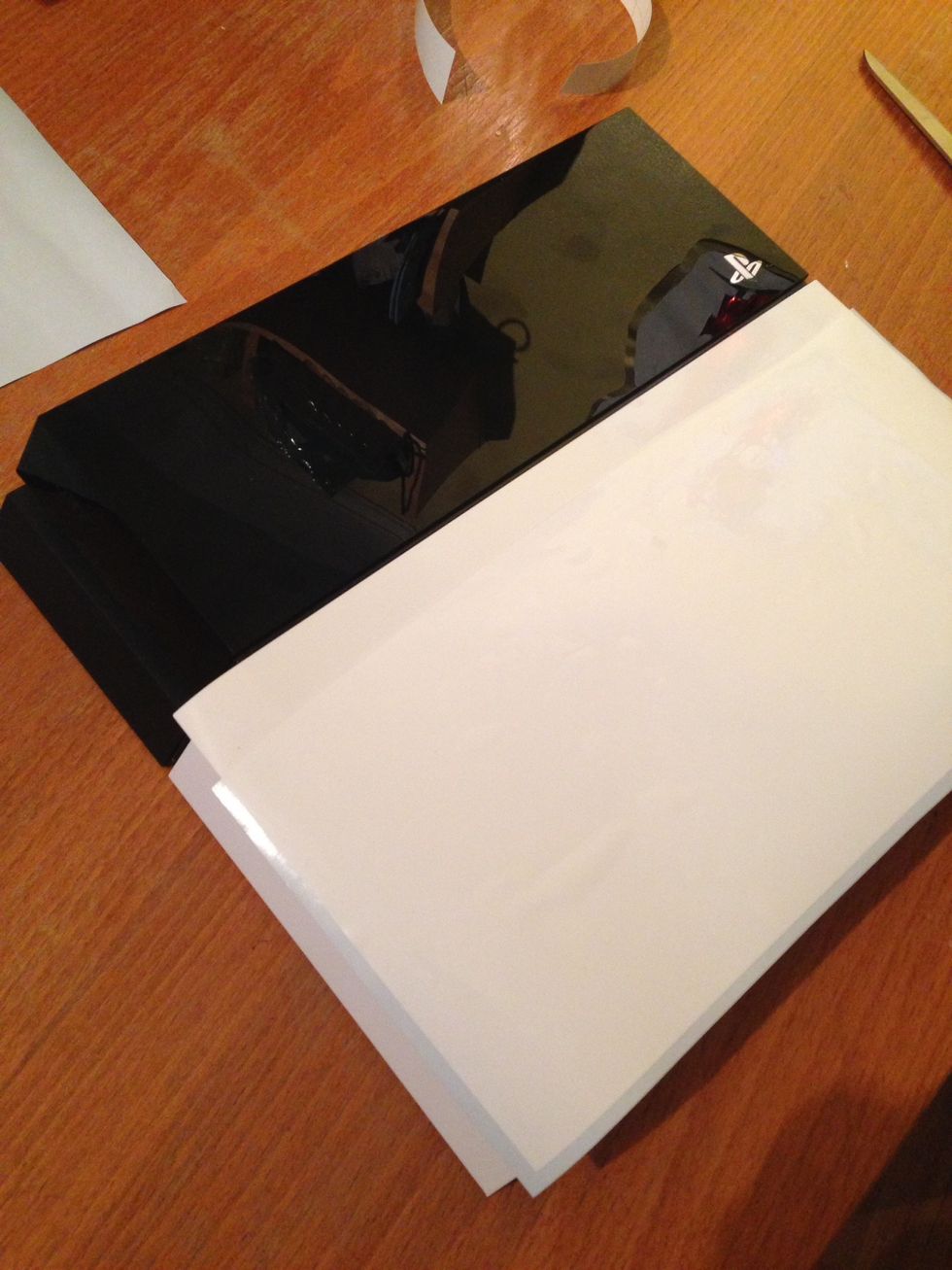 Your PS4 should look at this. Next you need to pull the vinyl tight and smooth over the face of your PS4.