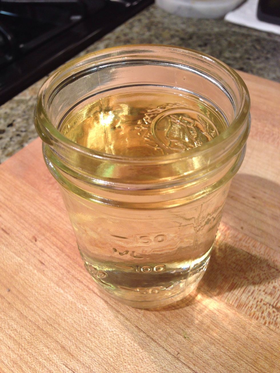 Your rice (and chef) are thirsty for that Pinot Grigio you picked up. Give a healthy glass or up to a cup to your arborio (don't worry you won't regret using a $15 bottle for this, live a little).