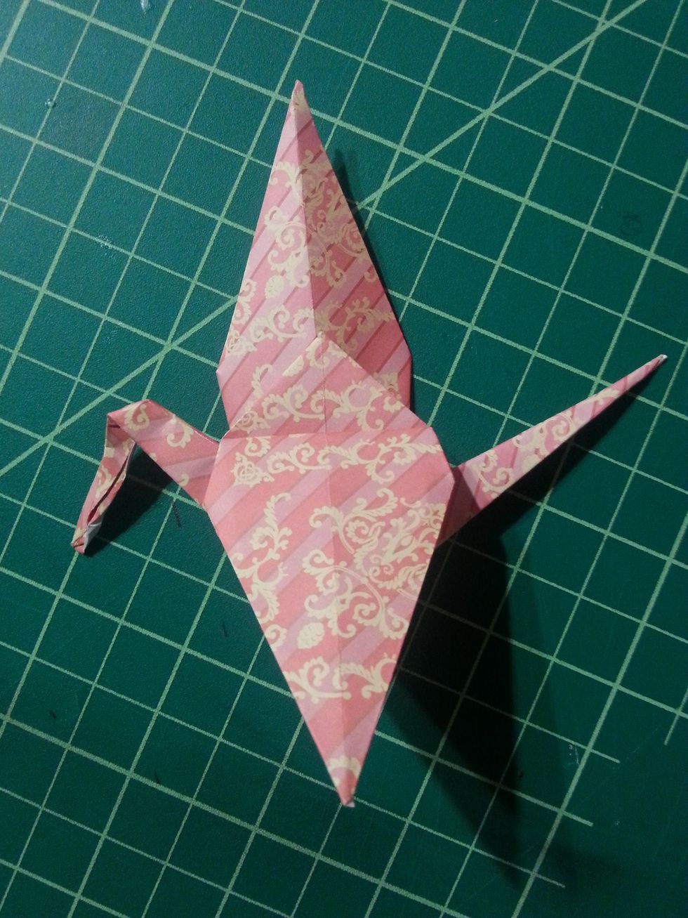 Your shape will resemble the picture on the left. Now we will flip the shape over, and do the same for the other flap.