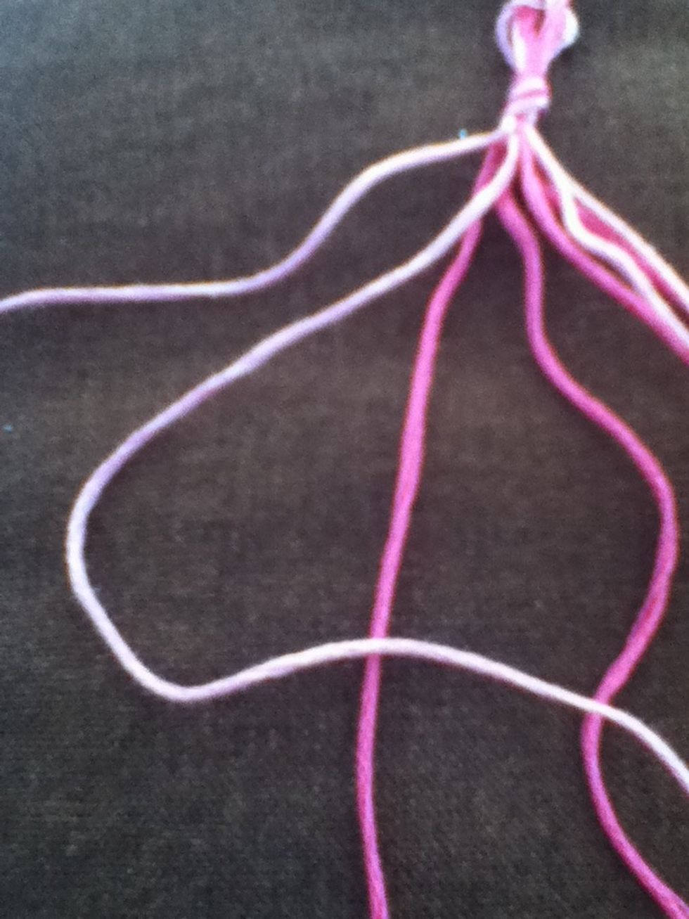 Your starting strand will have moved to the right. Make two forward knots with the strand.