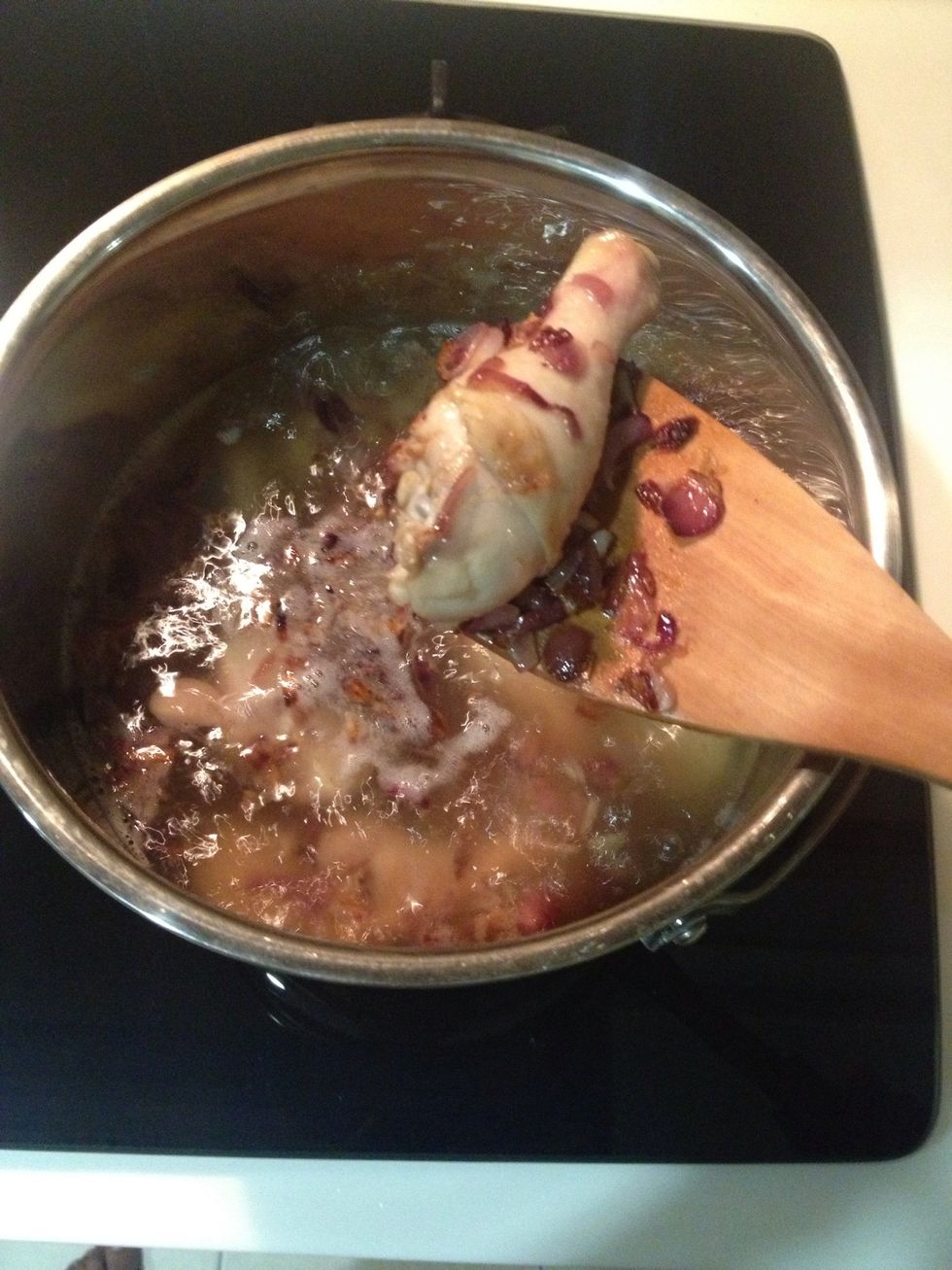 Your water should be start boiling by now, transfer everything from the pan to the pot.