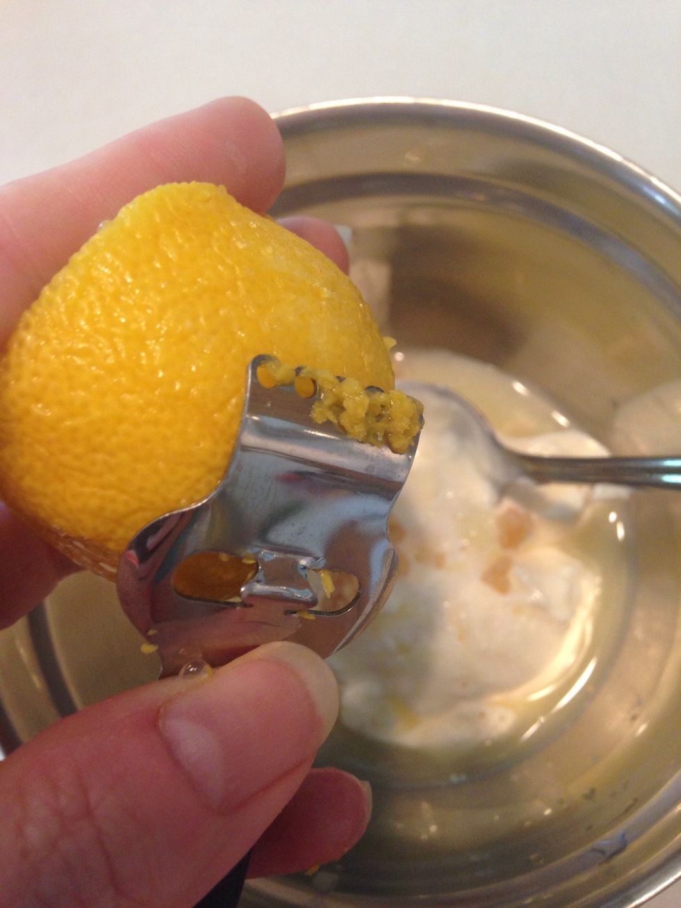 Zest a lemon and add the shavings.