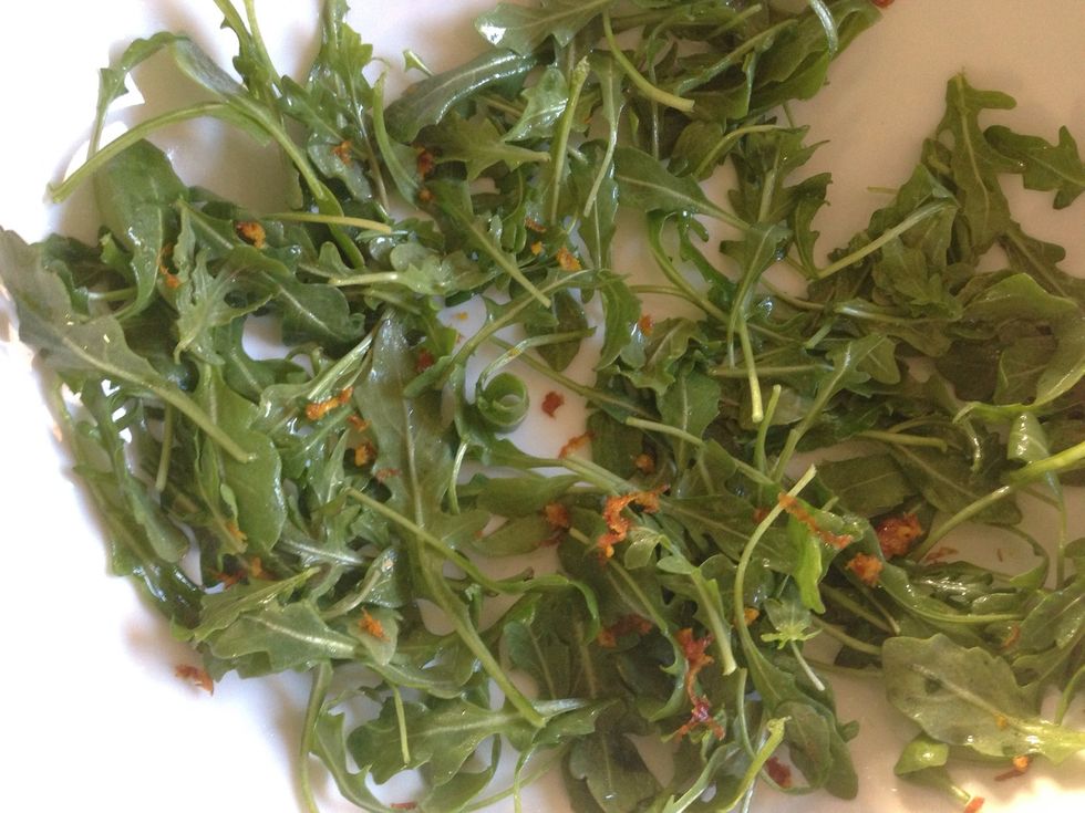 Zest about 1 tablespoon of an orange peel onto the greens and mix. I zested the blood orange because of its beautiful color.