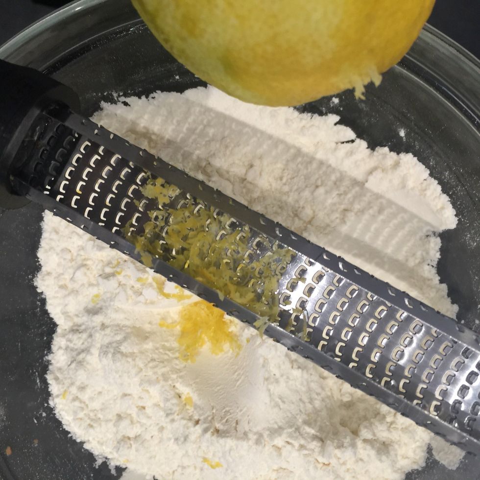 Zest the lemon over the flour