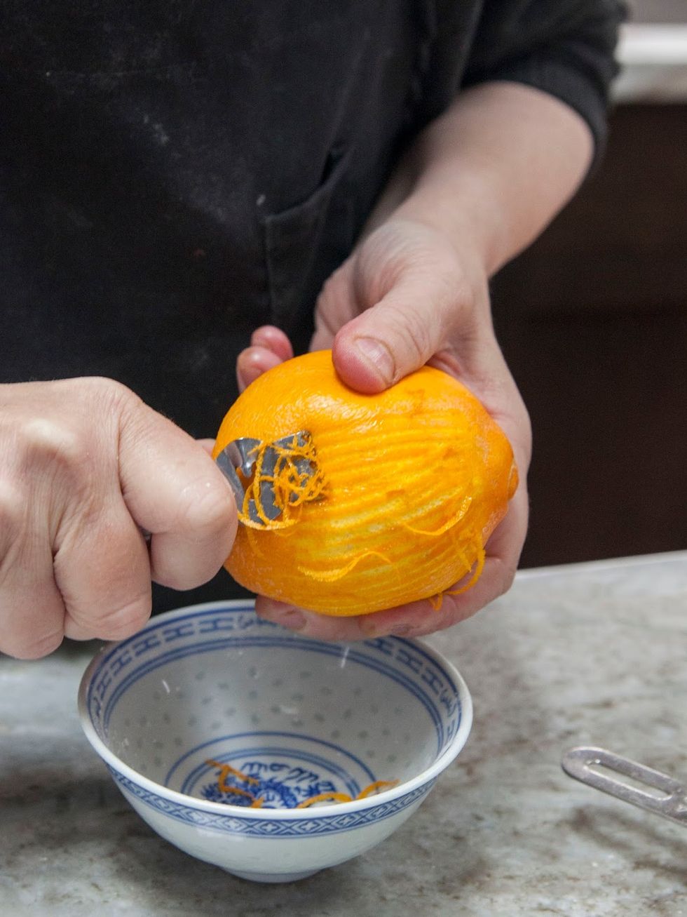 Zest the orange and set it aside.