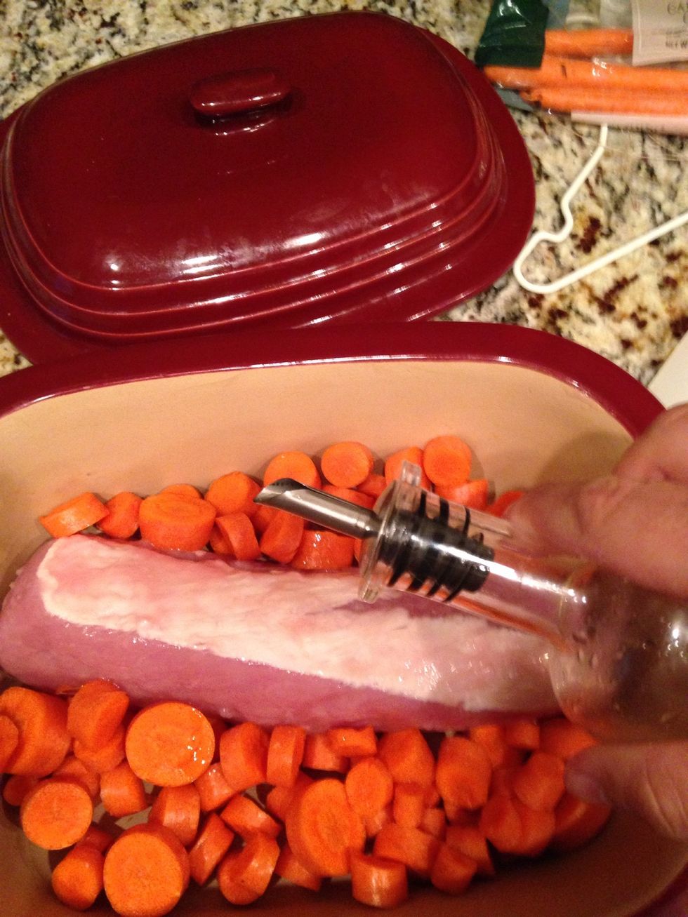 Zig zag a little olive oil over pork and carrots