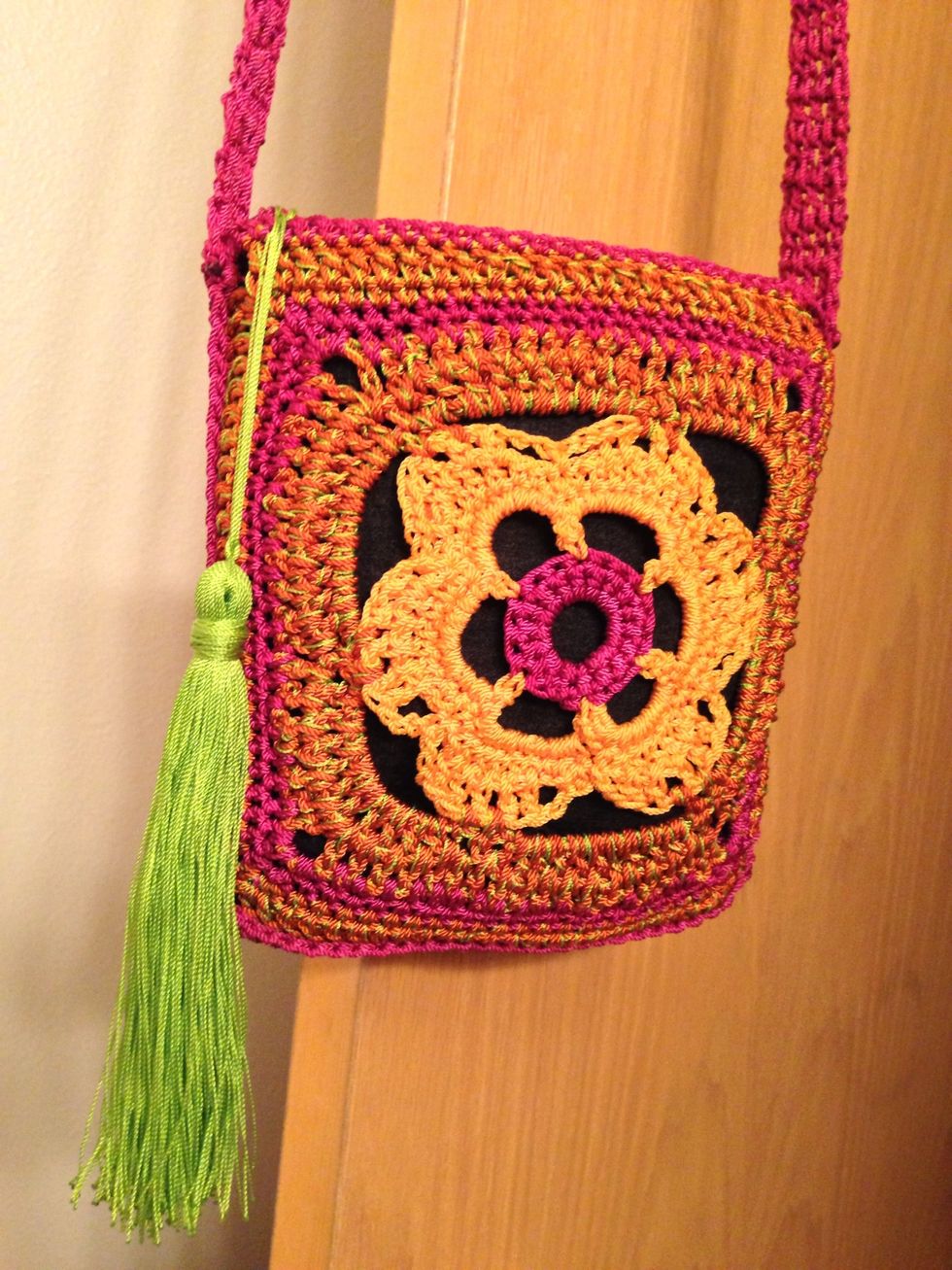 Zipper fob. Using a "pop" color, make a nice thick tassle for your zipper pull. The #2 nylon thread works well. Wrap around a book until it is half as thick as you want it.